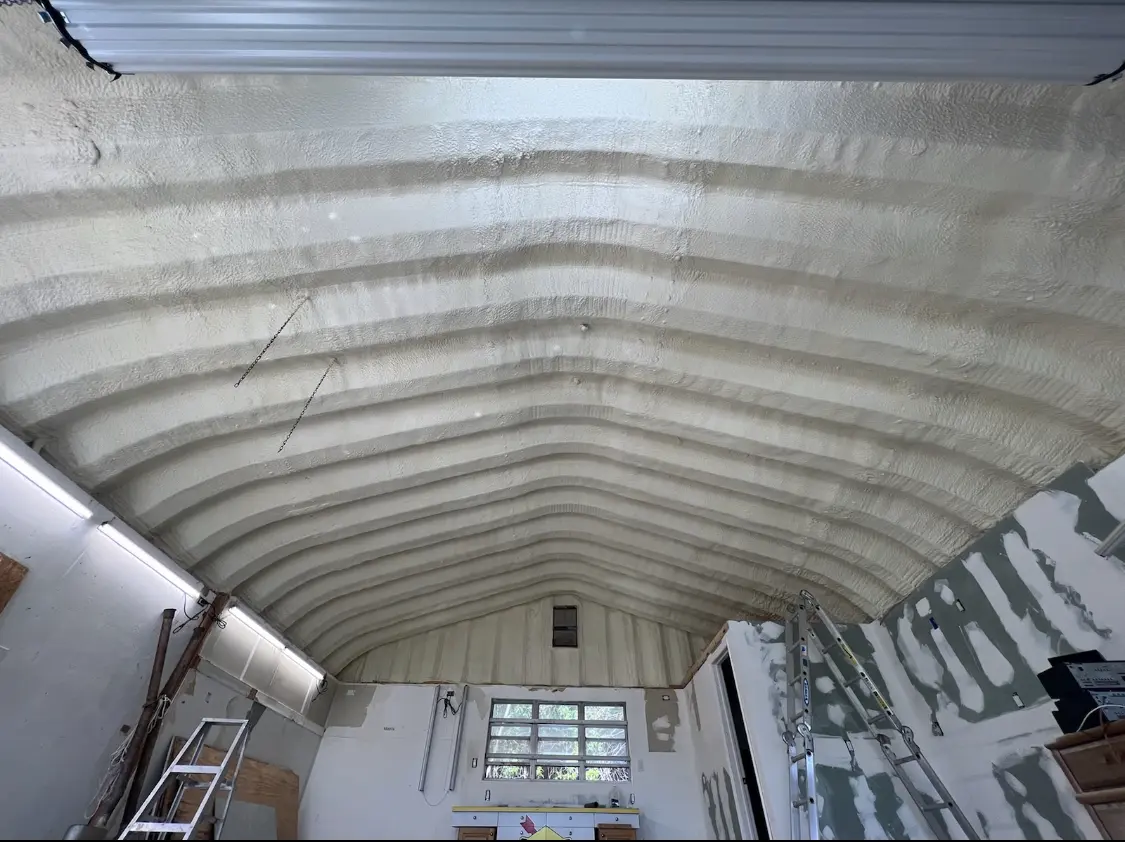 Spray polyurethane foam applied to the underside of a metal roof deck in Silverton